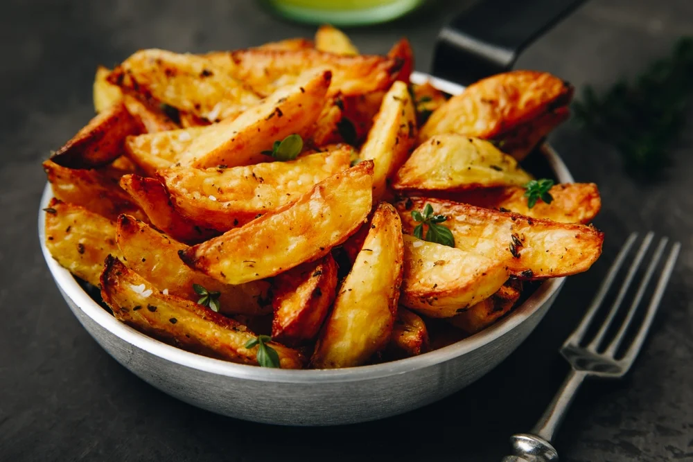 bowl of seasoned potato wedges