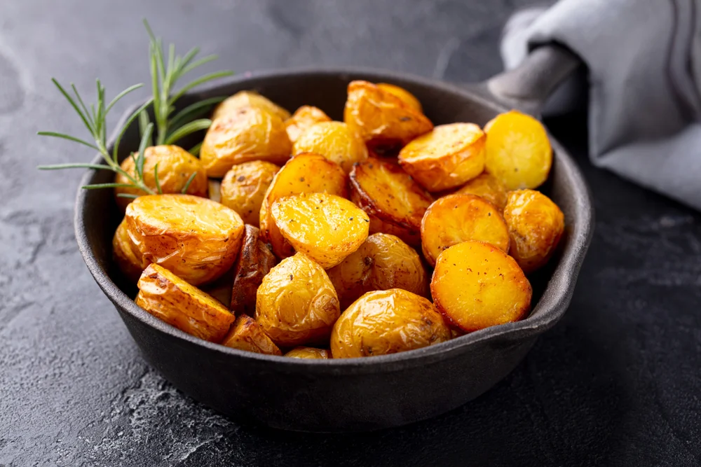 cast-iron pot of roasted baby potatoes