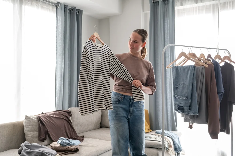 woman sorting through her clothes