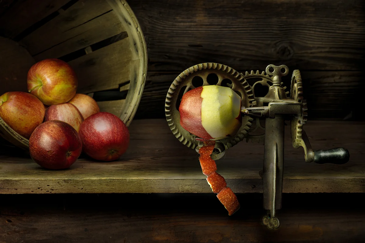 Vintage apple peeler in operation