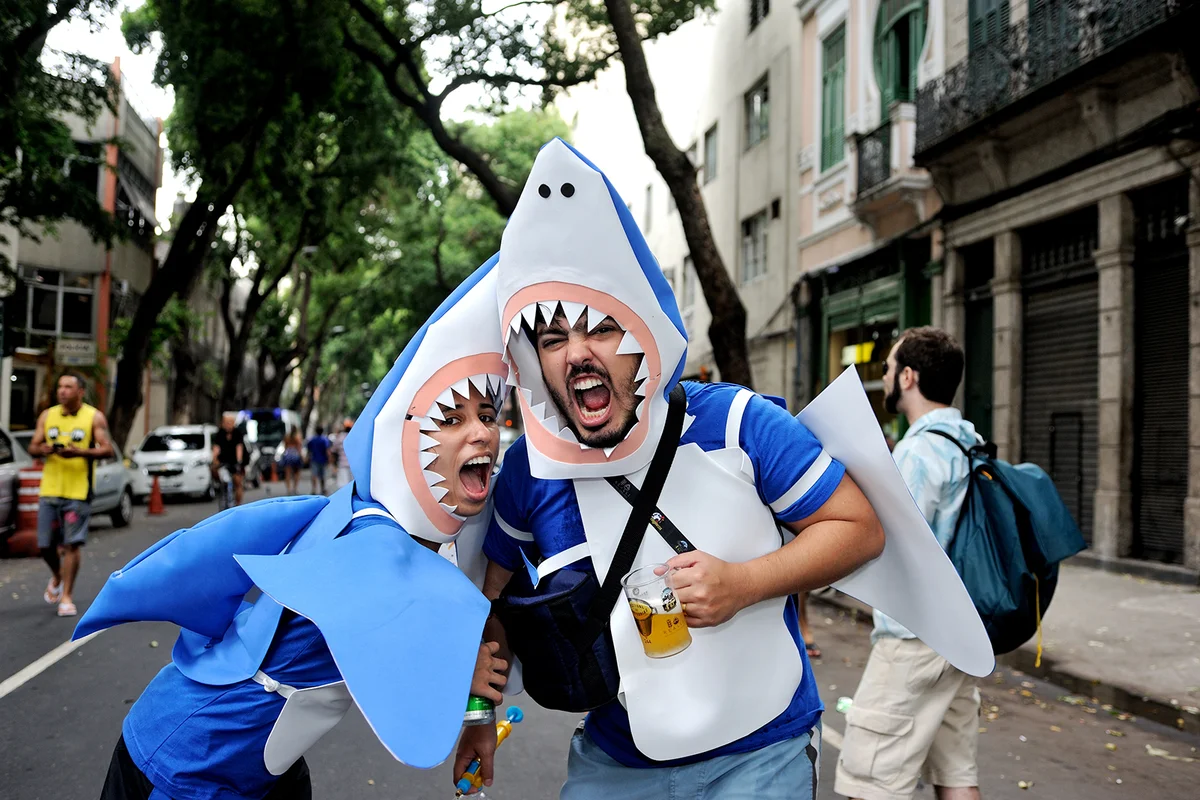A couple dressed up to look like a shark