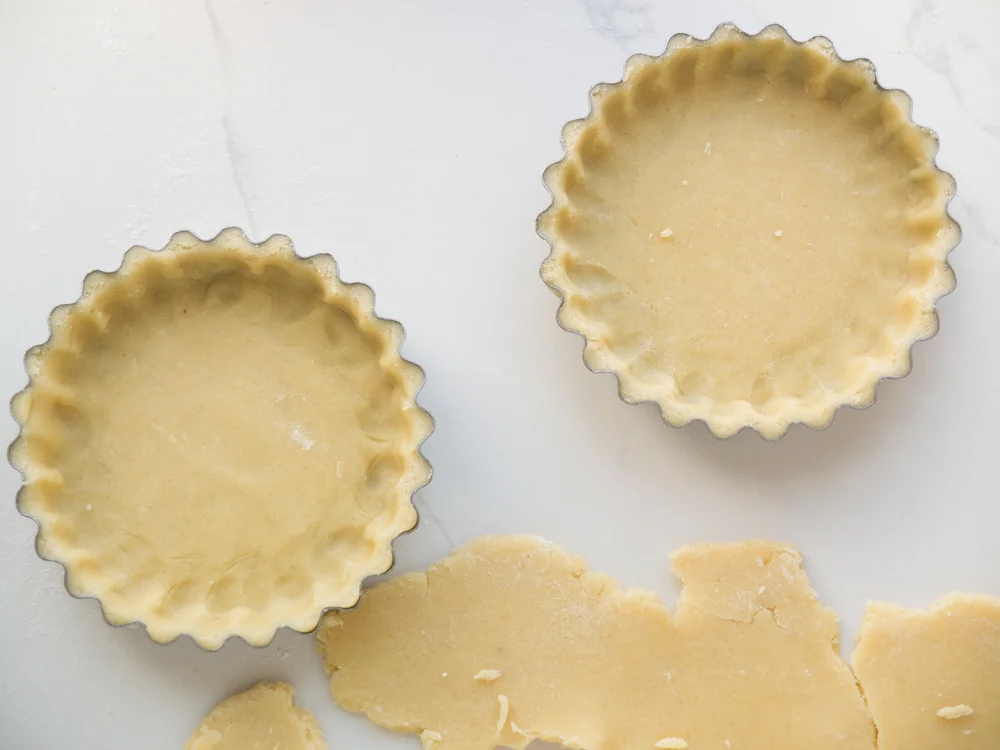 Pie crust trimmed from tarts
