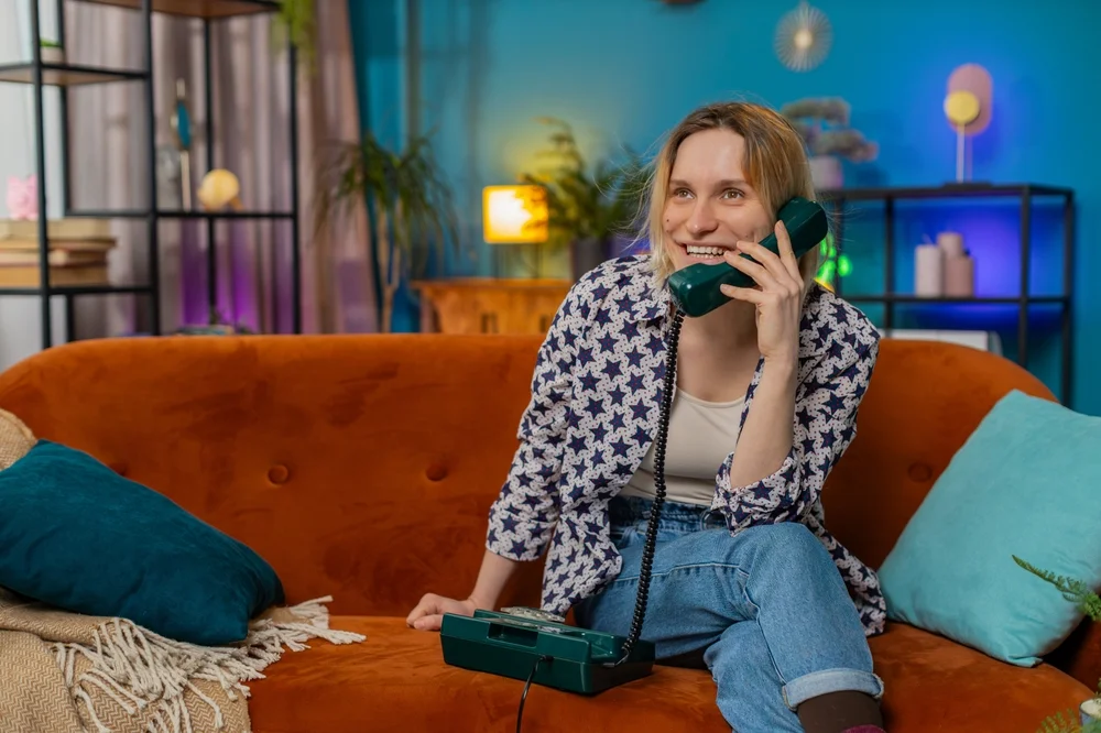 woman talking on a landline