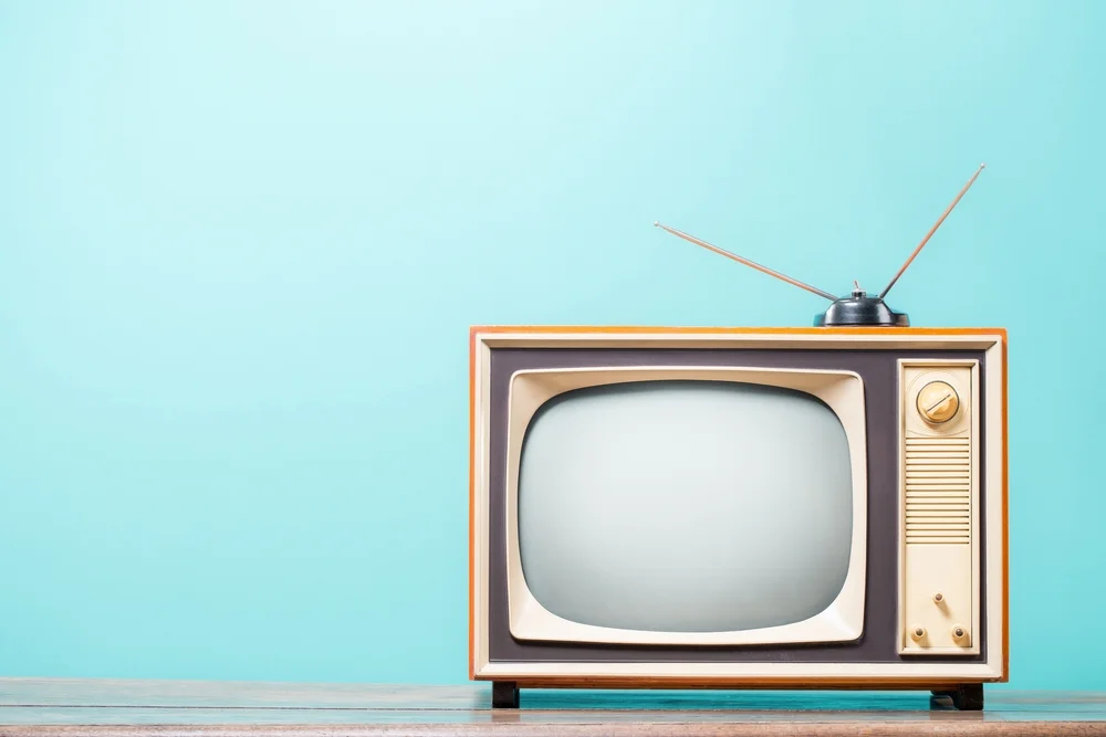 old-fashioned console TV with antenna