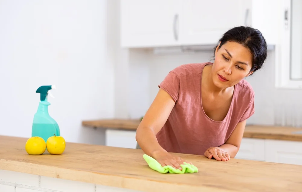 woman cleaning counter