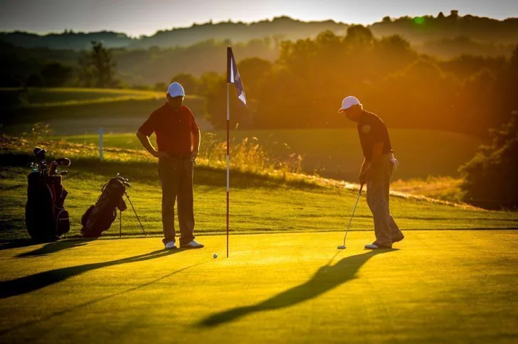 Golfers on a green