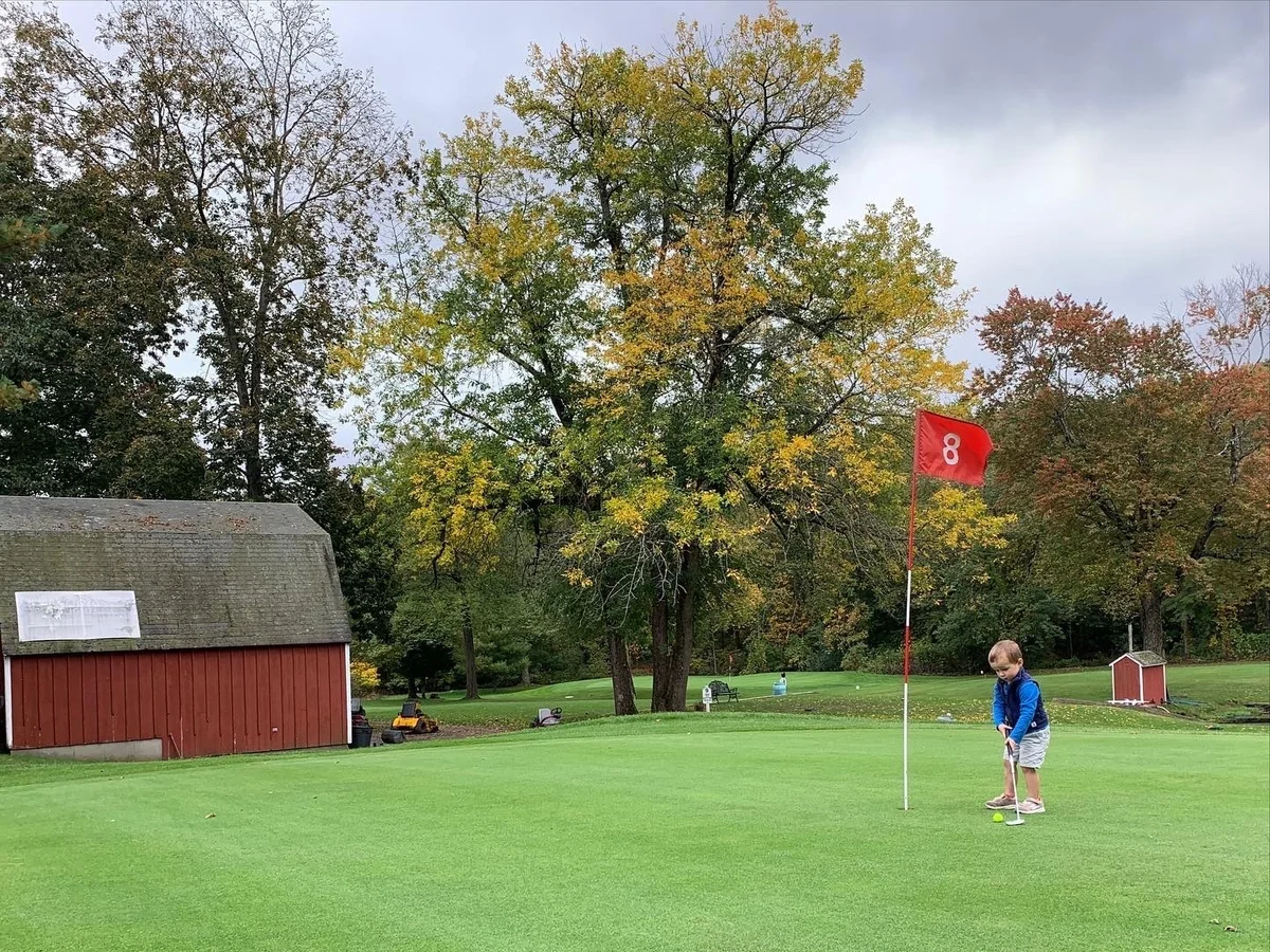 2-year-old enjoying a stroll around the golf course