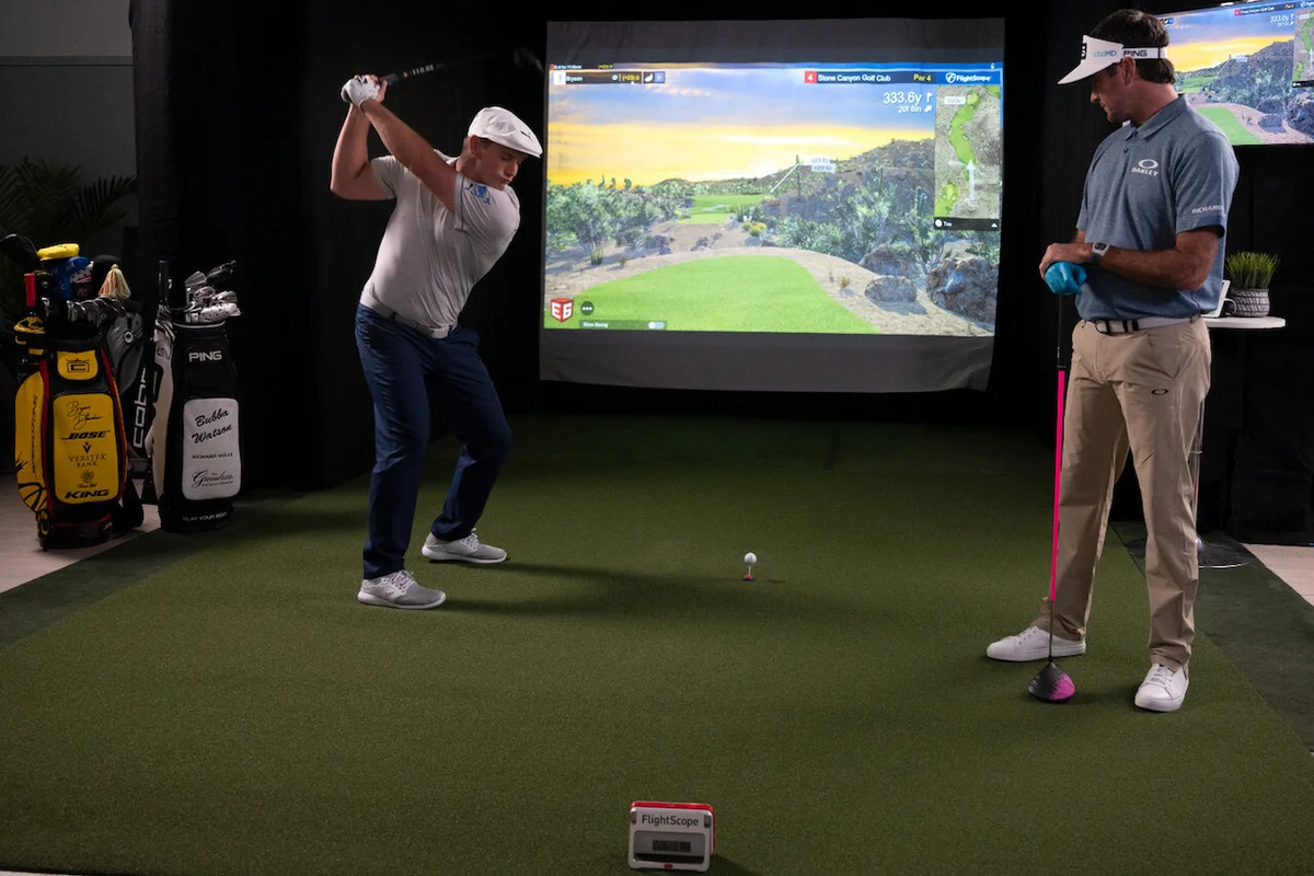 Bubba Watson and Bryson DeChambeau using golf simulator