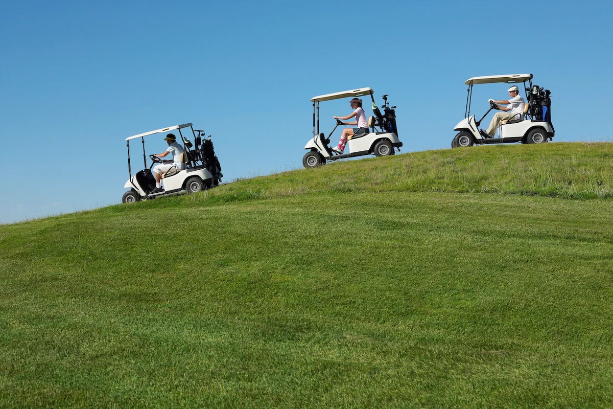 Golf carts on hilly course