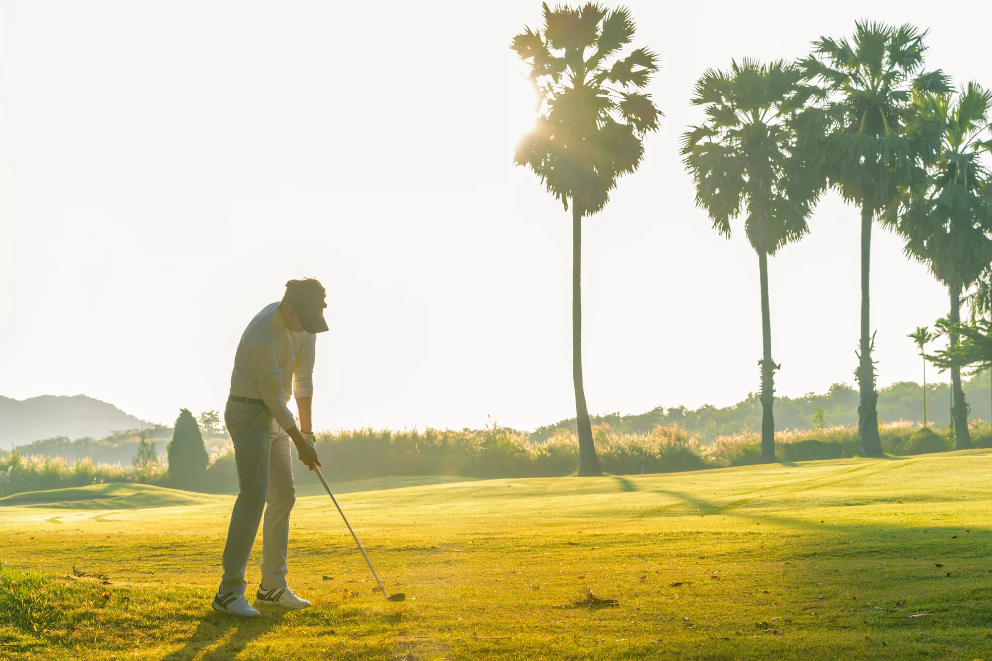 Golfer practicing chip shots