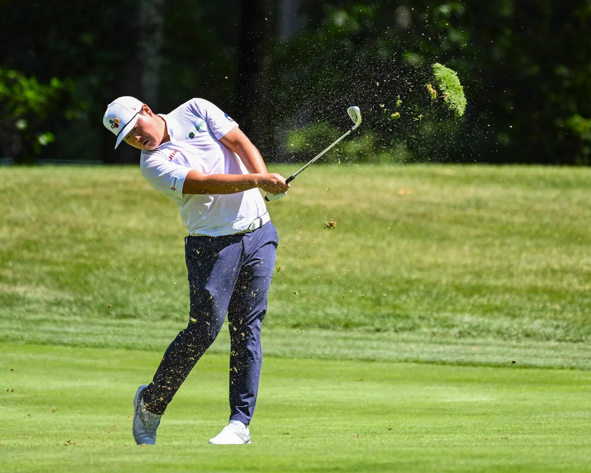 Golf divot swung in the air