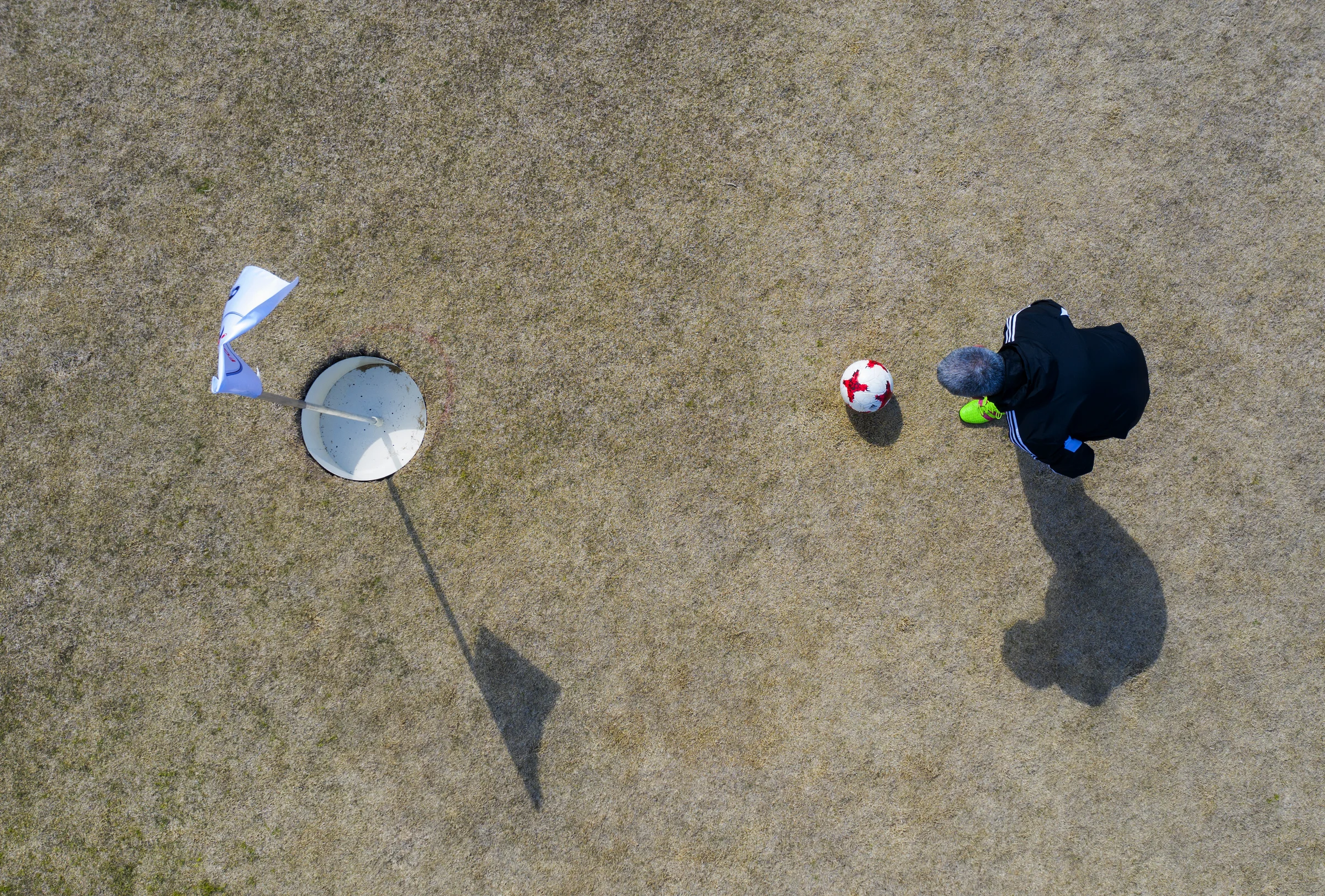 Drone image of a man playing FootGolf