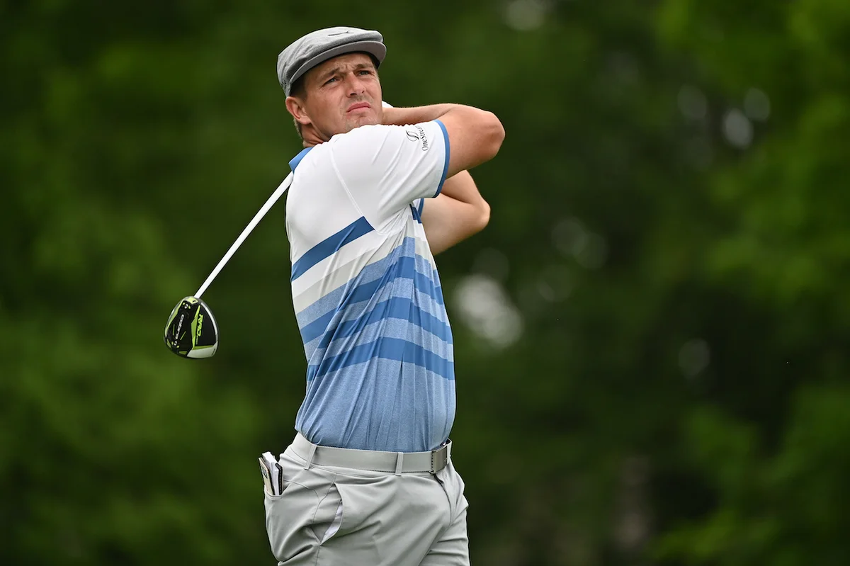 Bryson DeChambeau watches golf shot