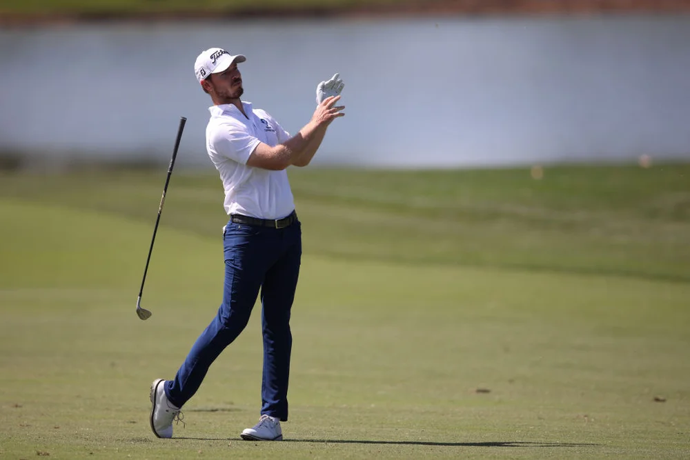 Golfer drops his club in disgust after shank