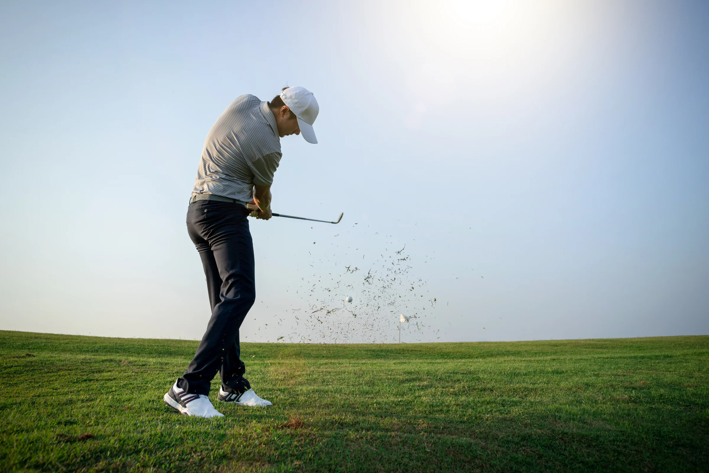 Golfer hitting a shot around the green