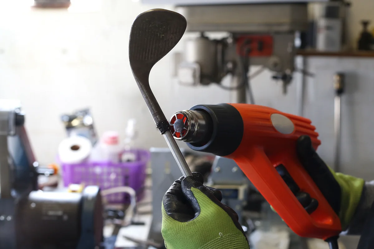 Repairing old golf club with drill