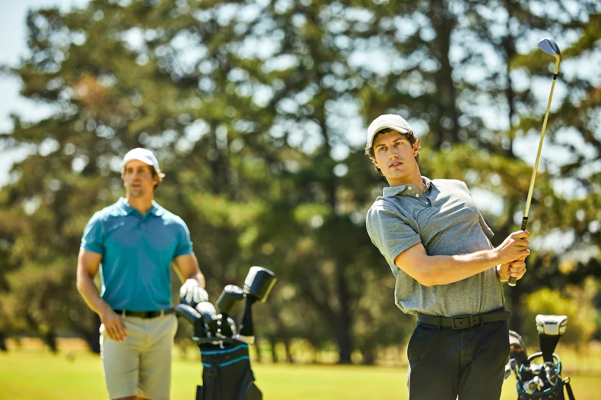 Two men watching golf shot