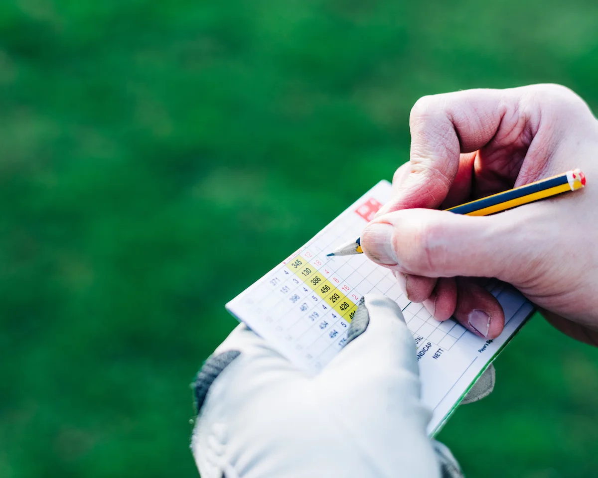 close-up of scorecard with pencil
