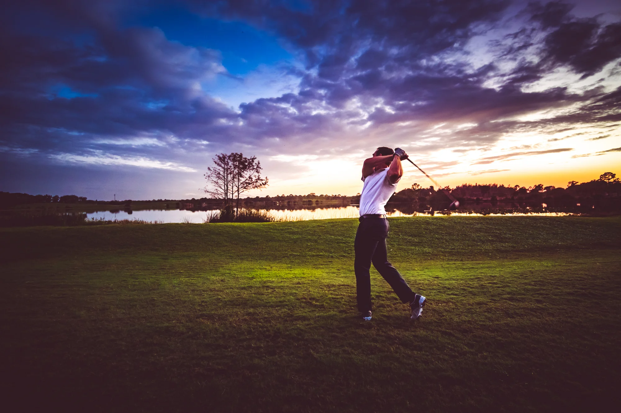 Man swinging a golf club