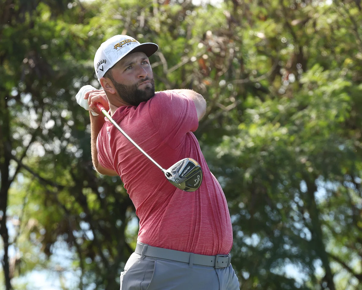 Jon Rahm watches shot after swing