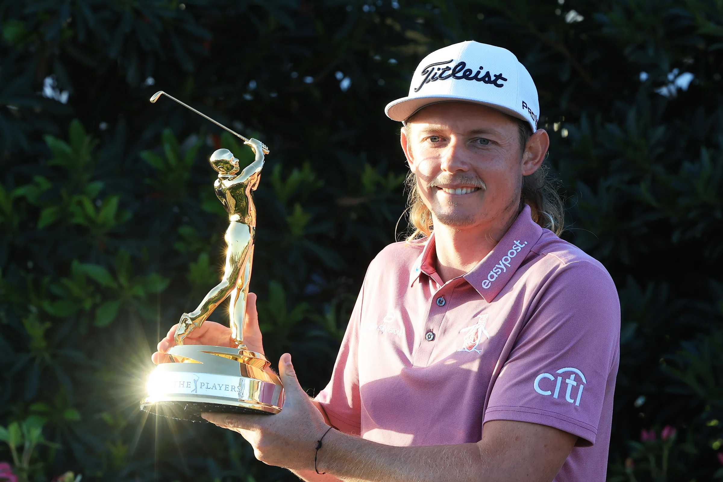 Cam Smith shows off the Players Championship trophy in 2022