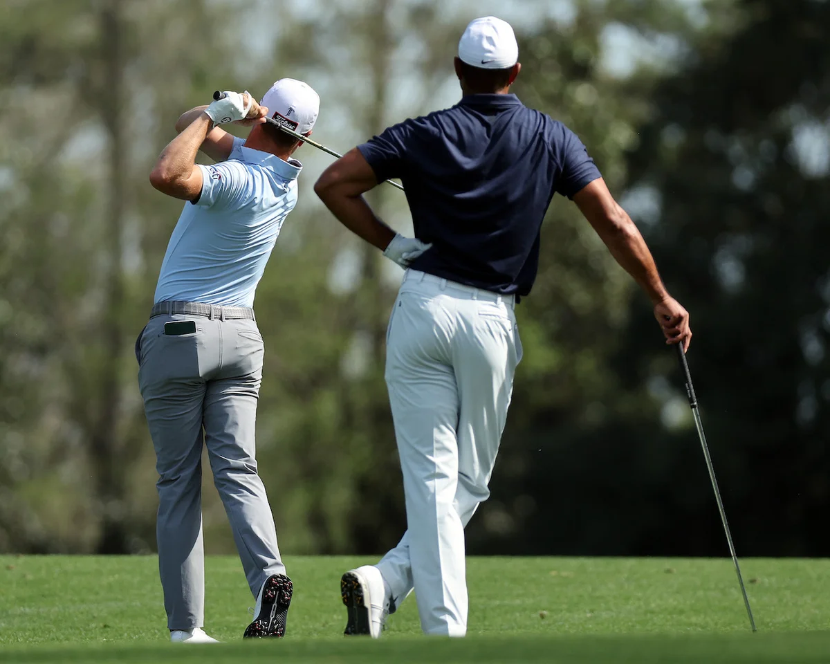 Justin Thomas and Tiger Woods practicing