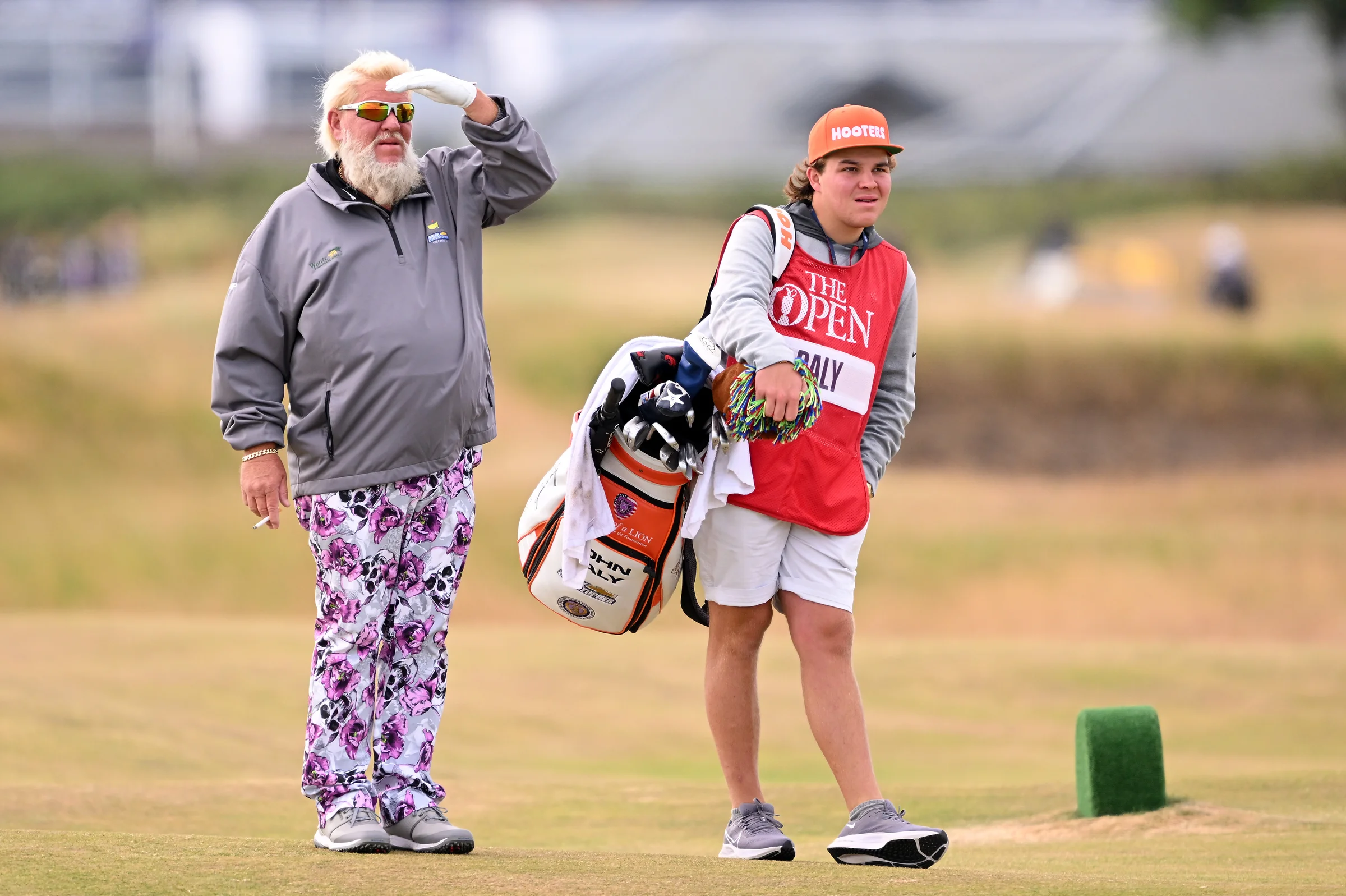 John Daly wearing skull-patterned pants