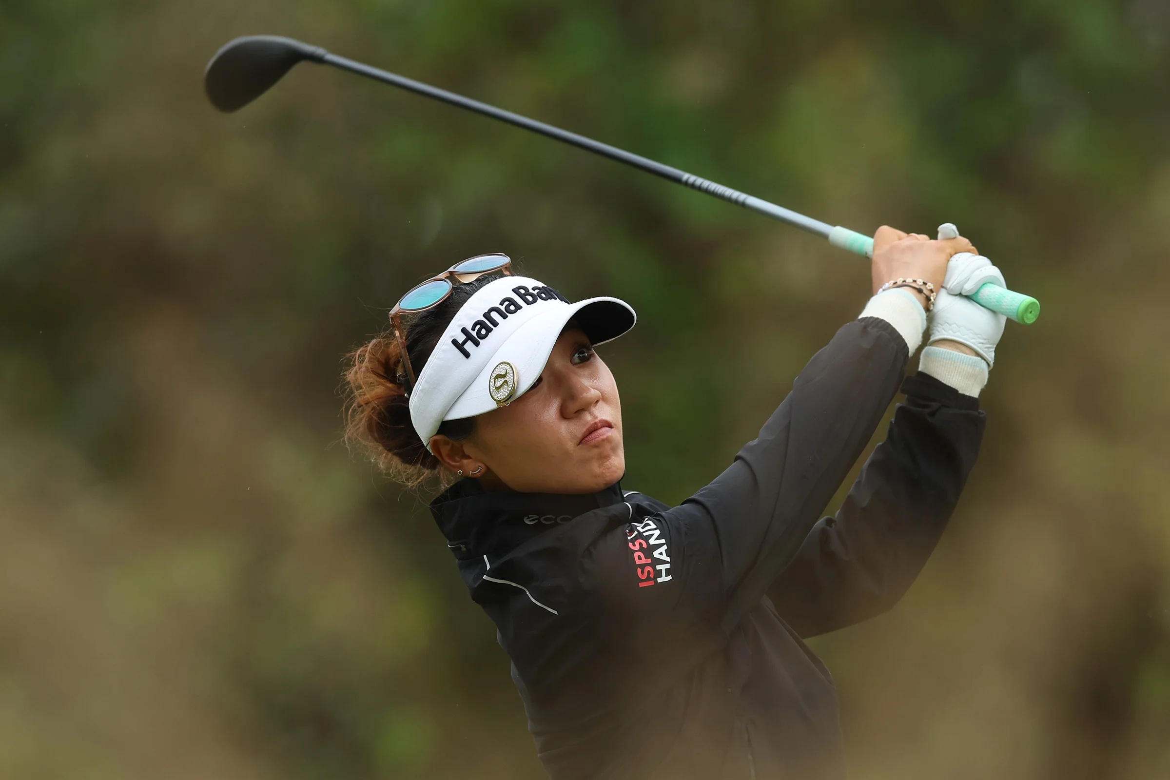 Lydia Ko hitting a hybrid golf club