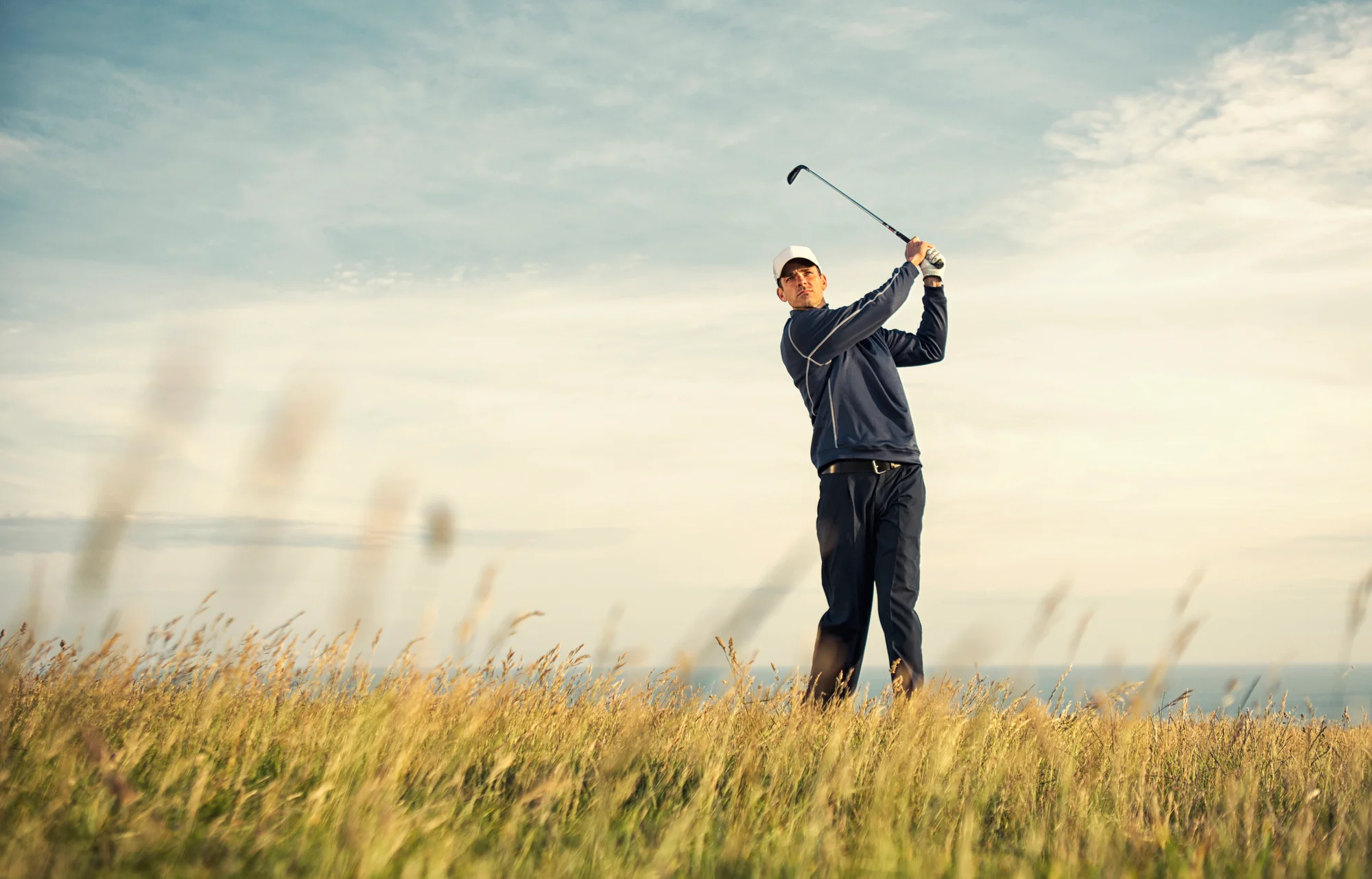 golfer practicing on a golf course