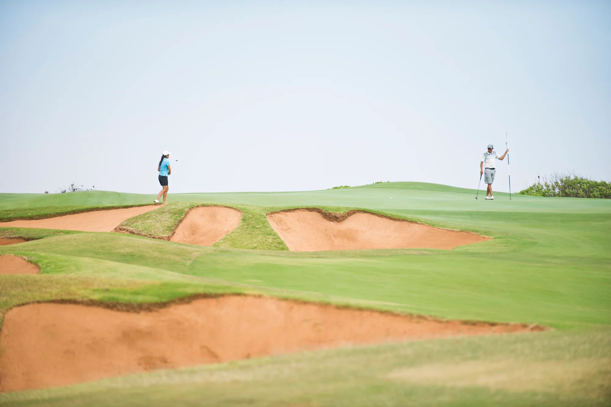 Golfer hitting bump and run shot