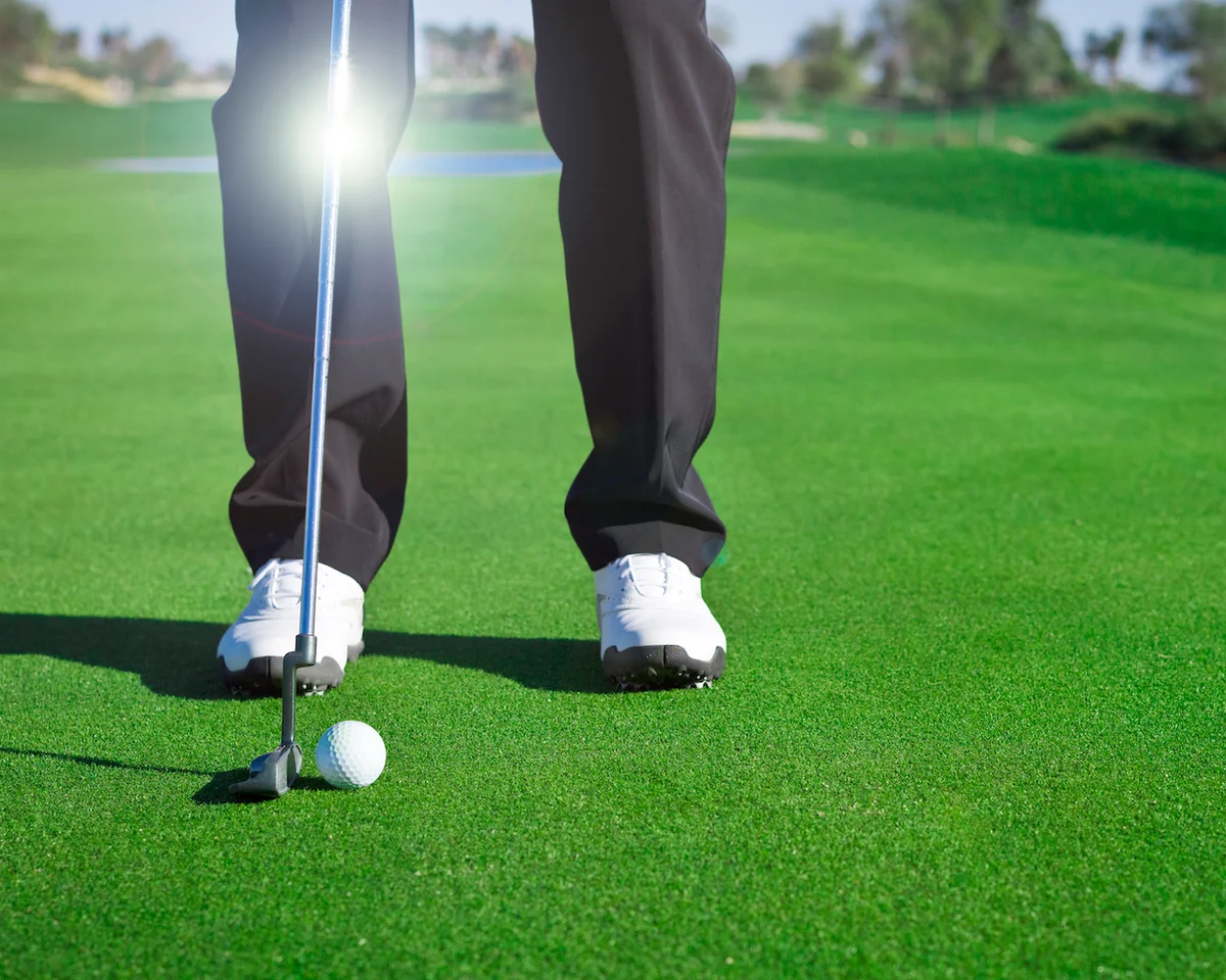 Golfer about to putt