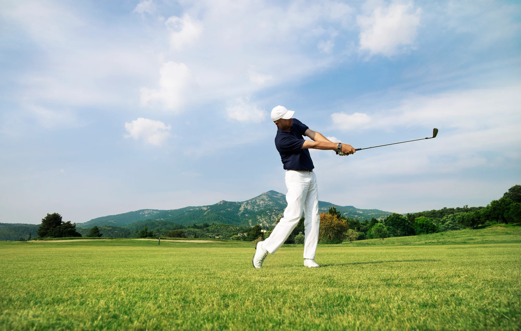 Golfer practicing his golf swing