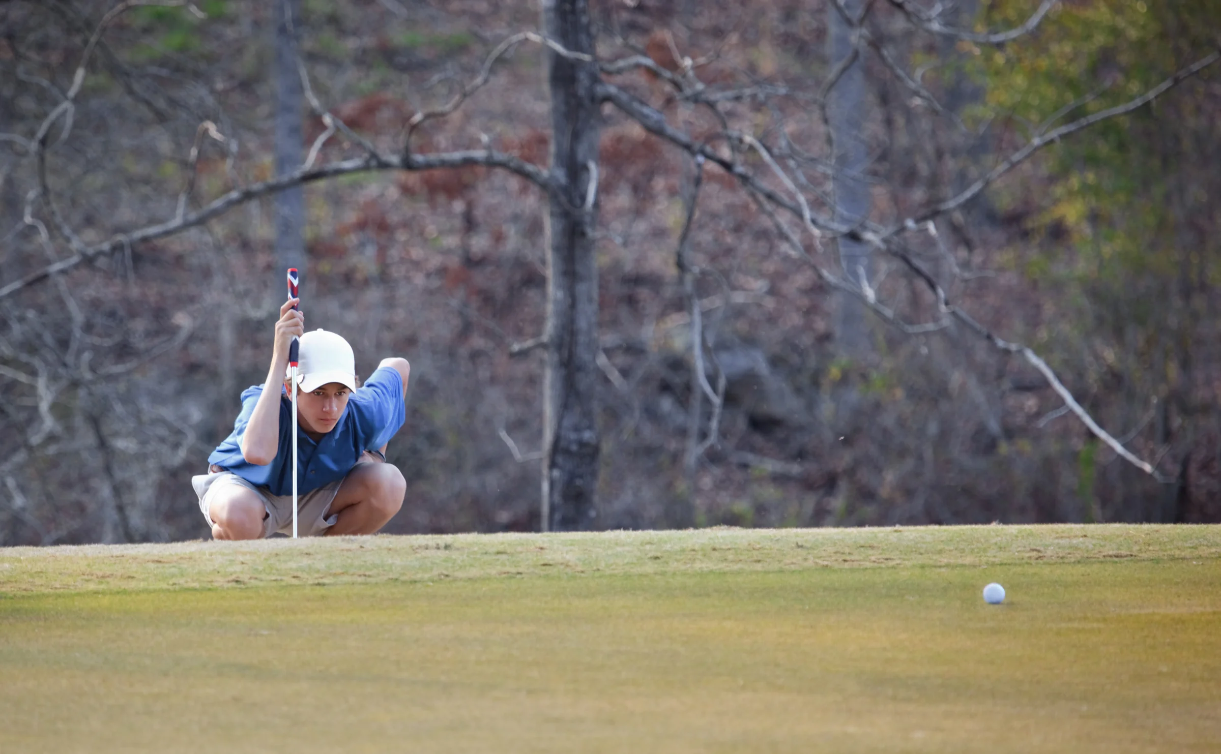 Golfer reads his putt