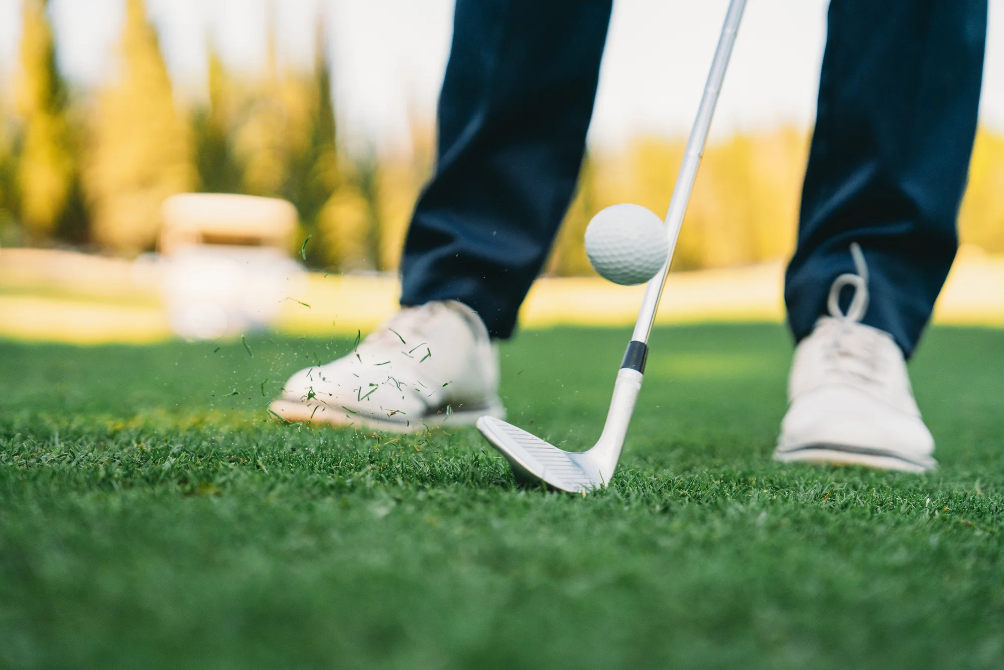 Golfer hitting a wedge shot