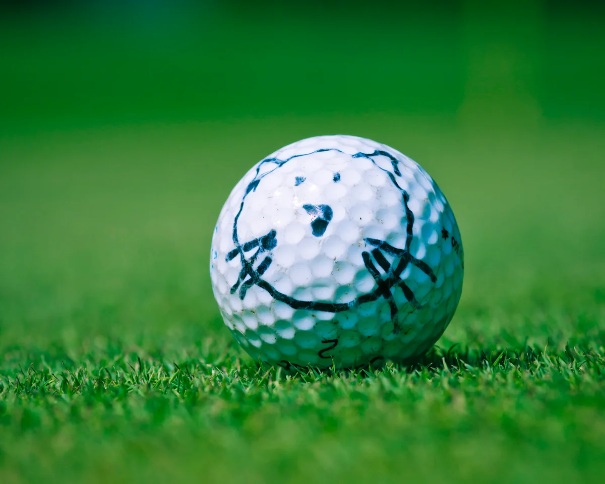cat drawing on golf ball