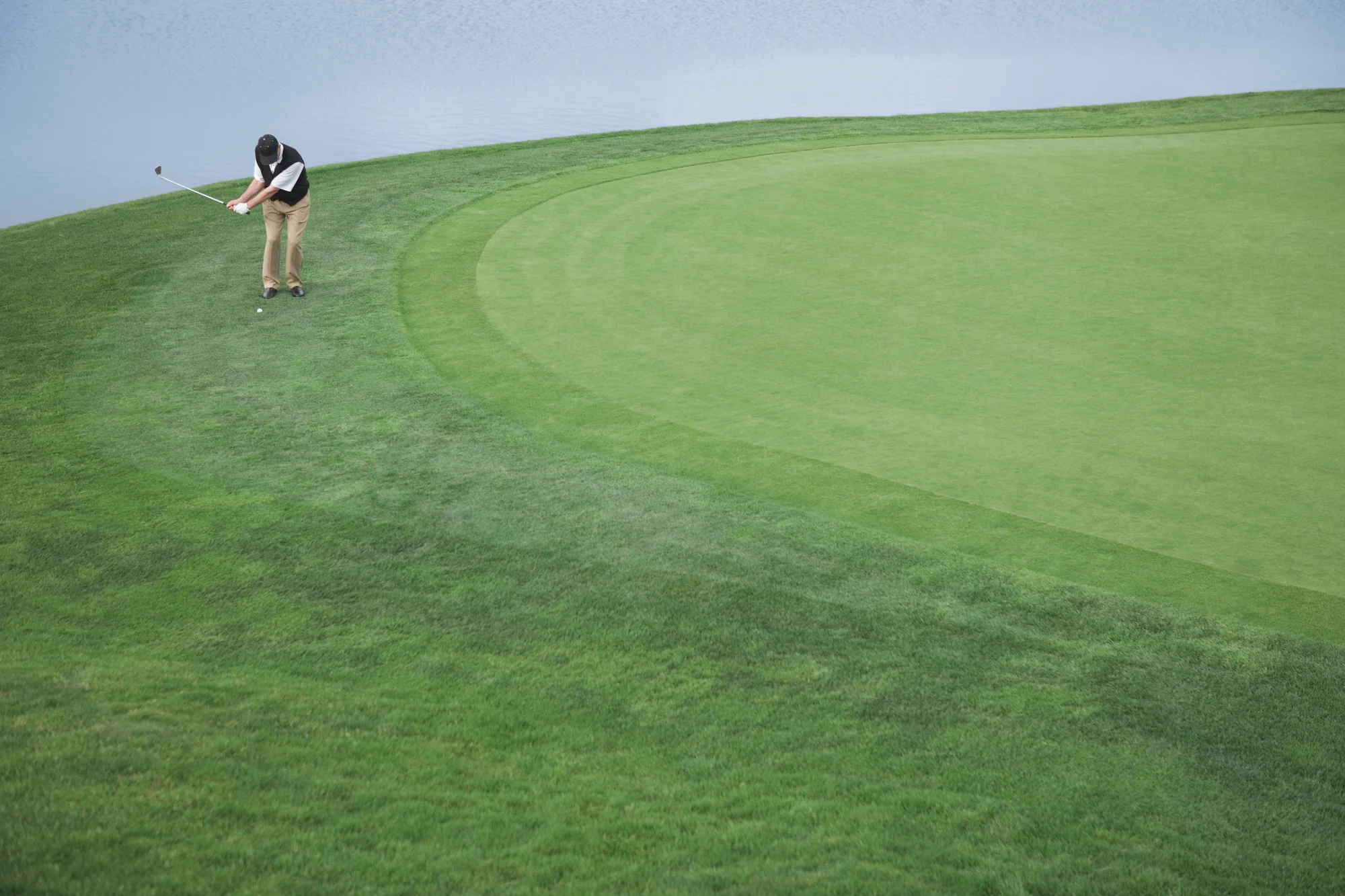 Golfer hitting a chip shot