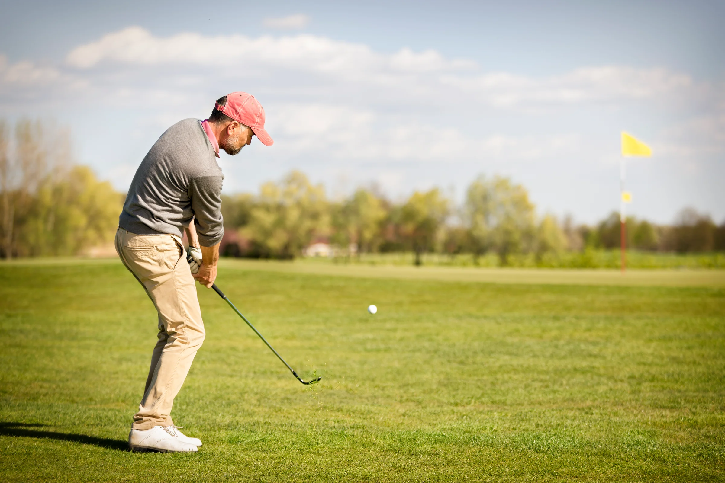 golfer hitting a pitch shot