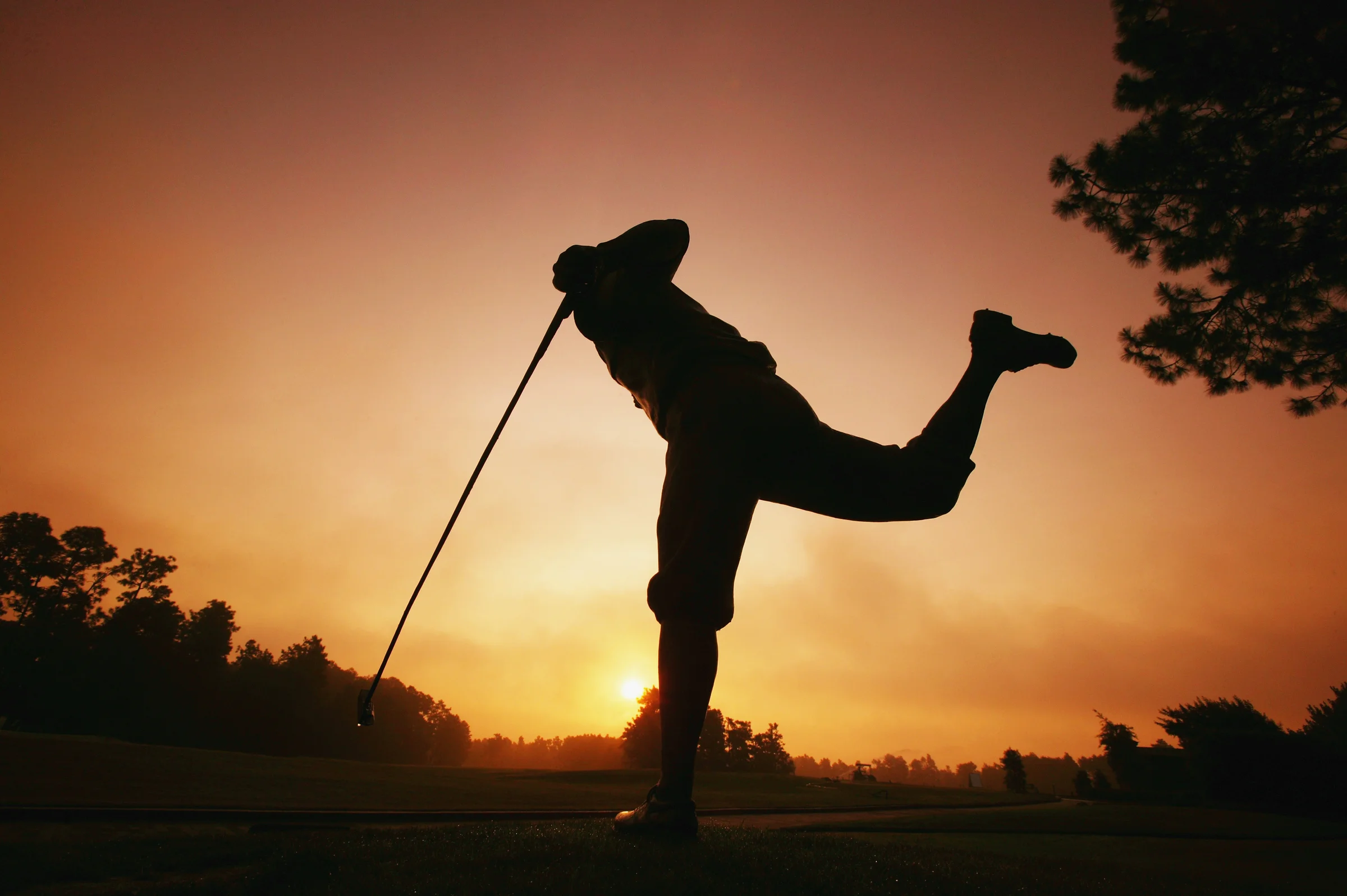 Pinehurst's statue of Payne Stewart at sun rise