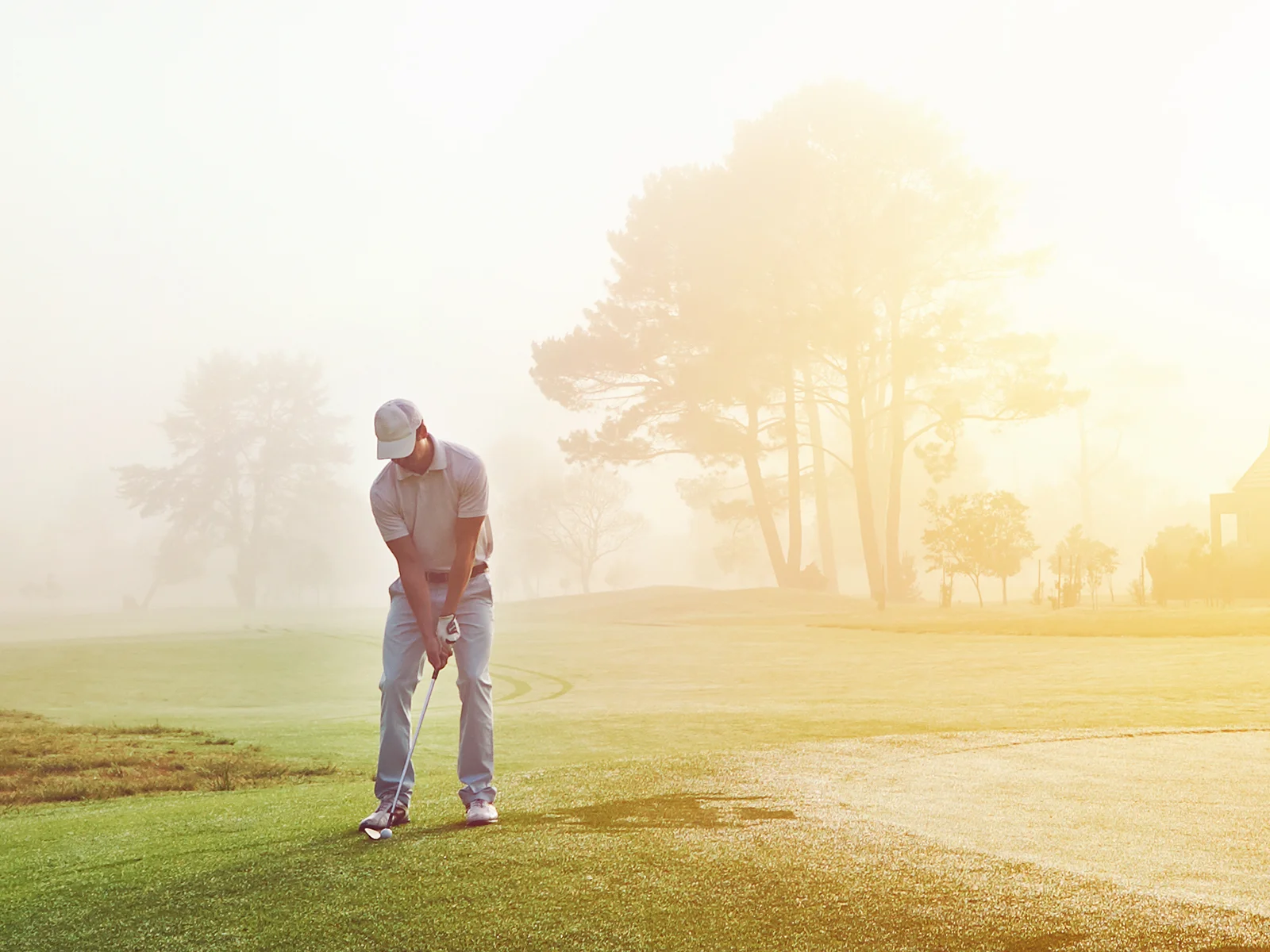 Golfer set up to hit a chip shot