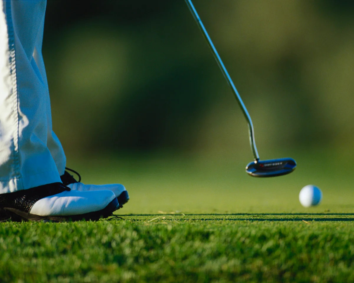 Golfer putt follow through