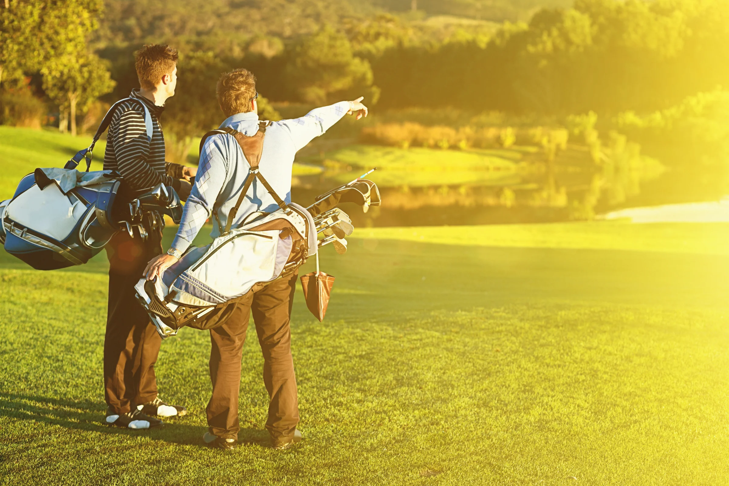 Golfer sharing course knowledge with playing partner