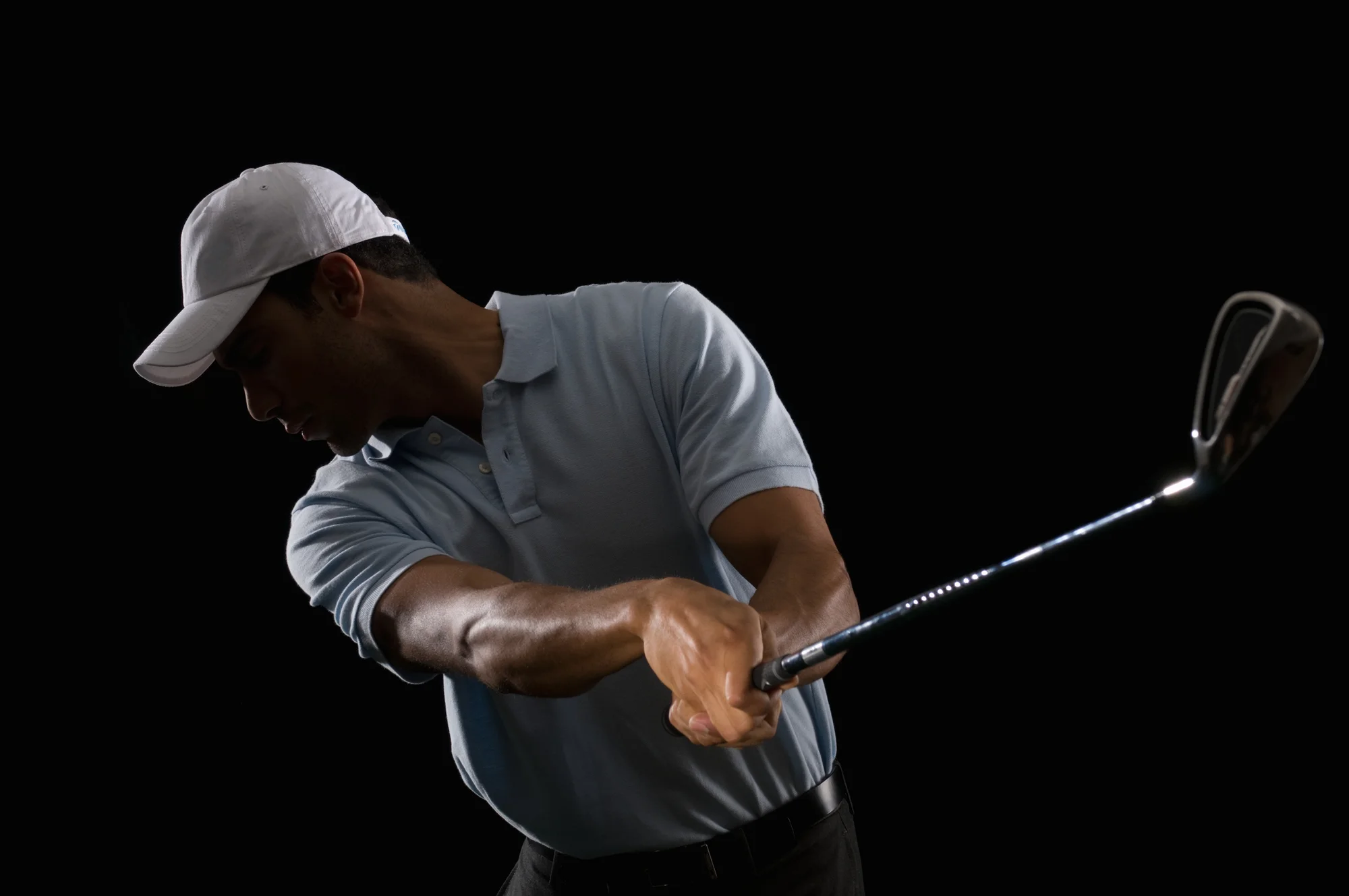 Man swinging a golf club