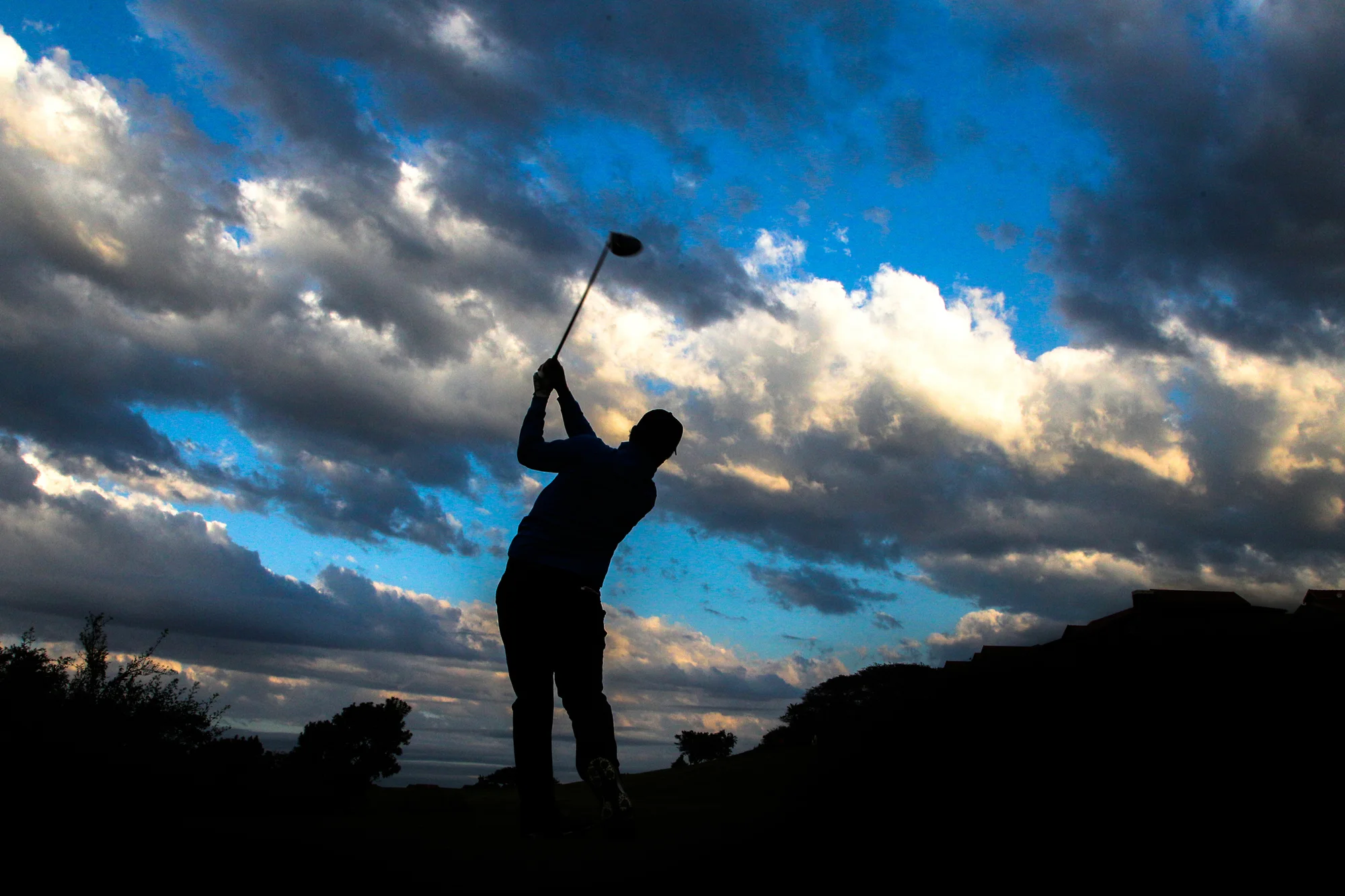 Golfer confidently hitting a draw with driver