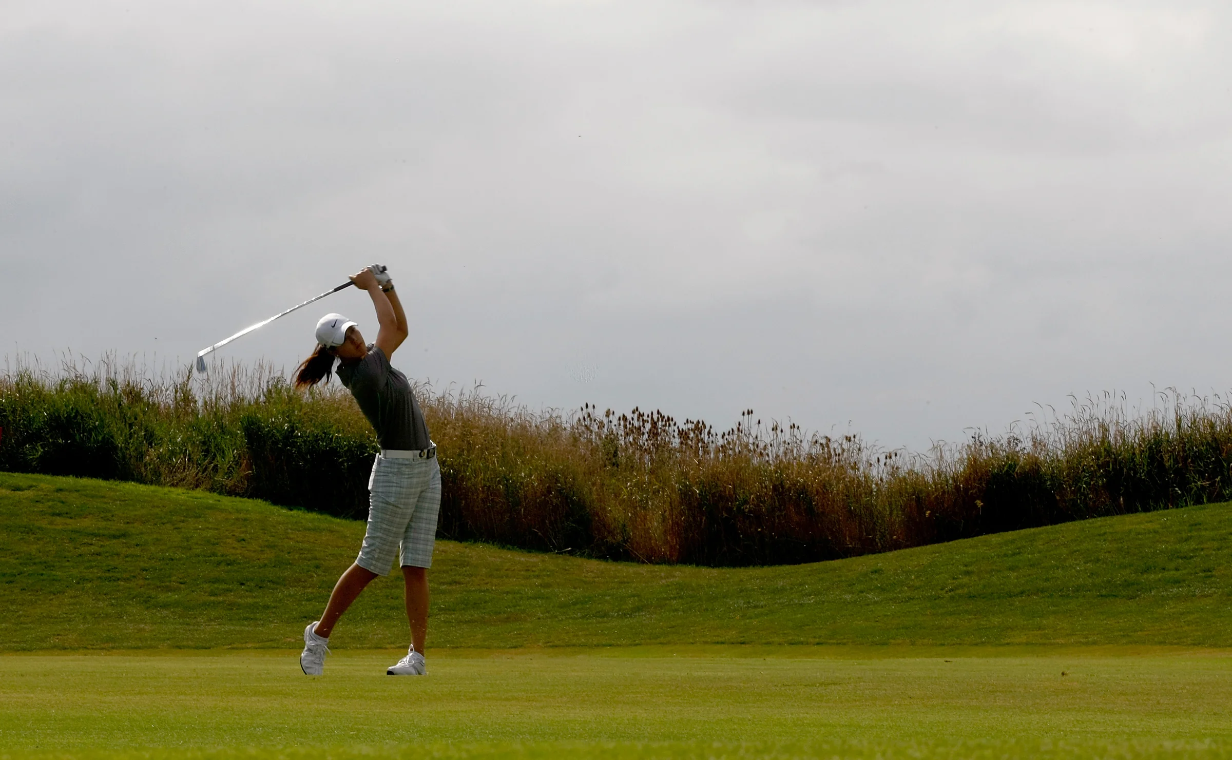 Michelle Wie hits a shot at Pumpkin Ridge's Ghost Creek course