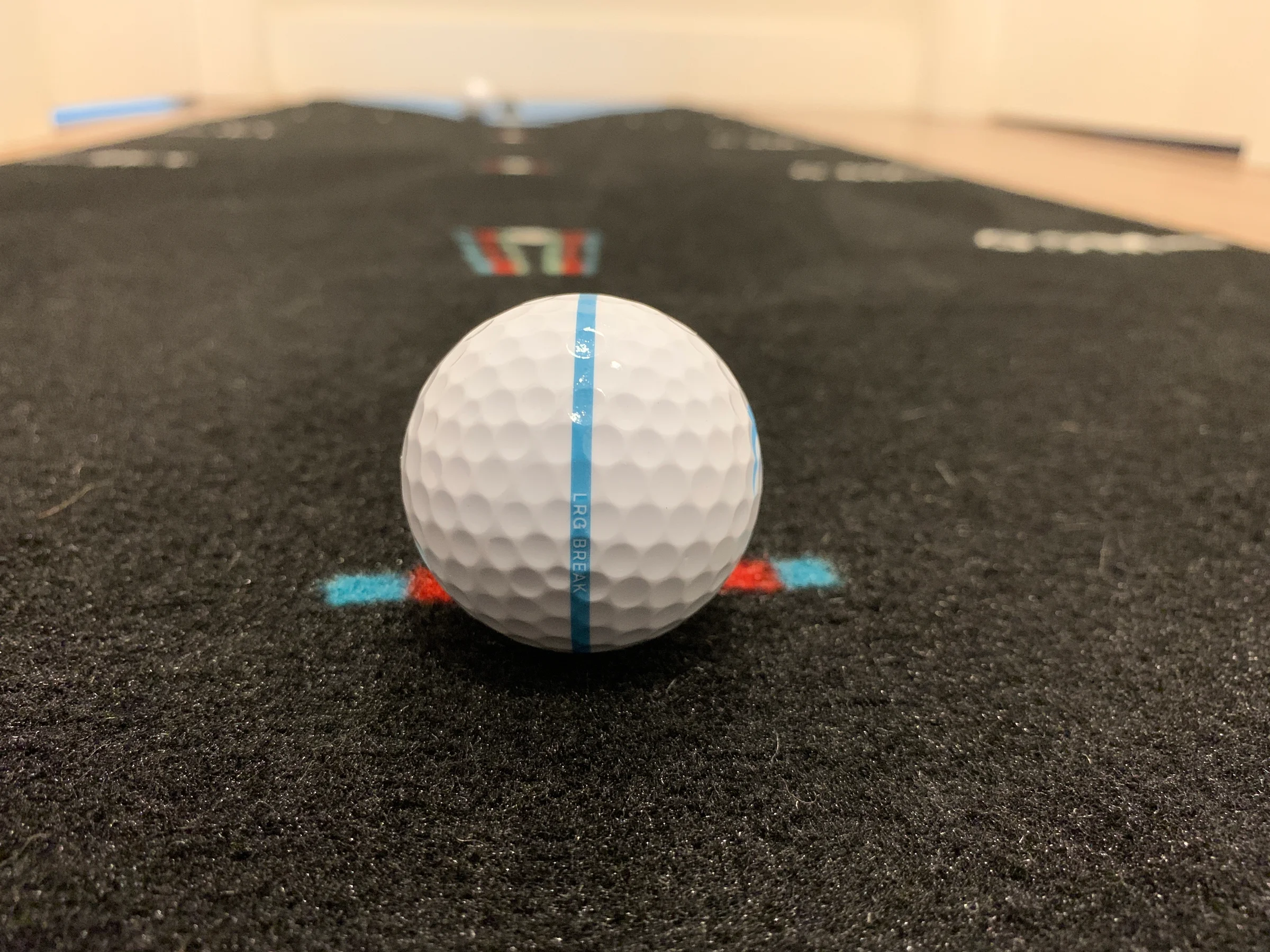 Putt lined up on Breaking Ball Putting Mat