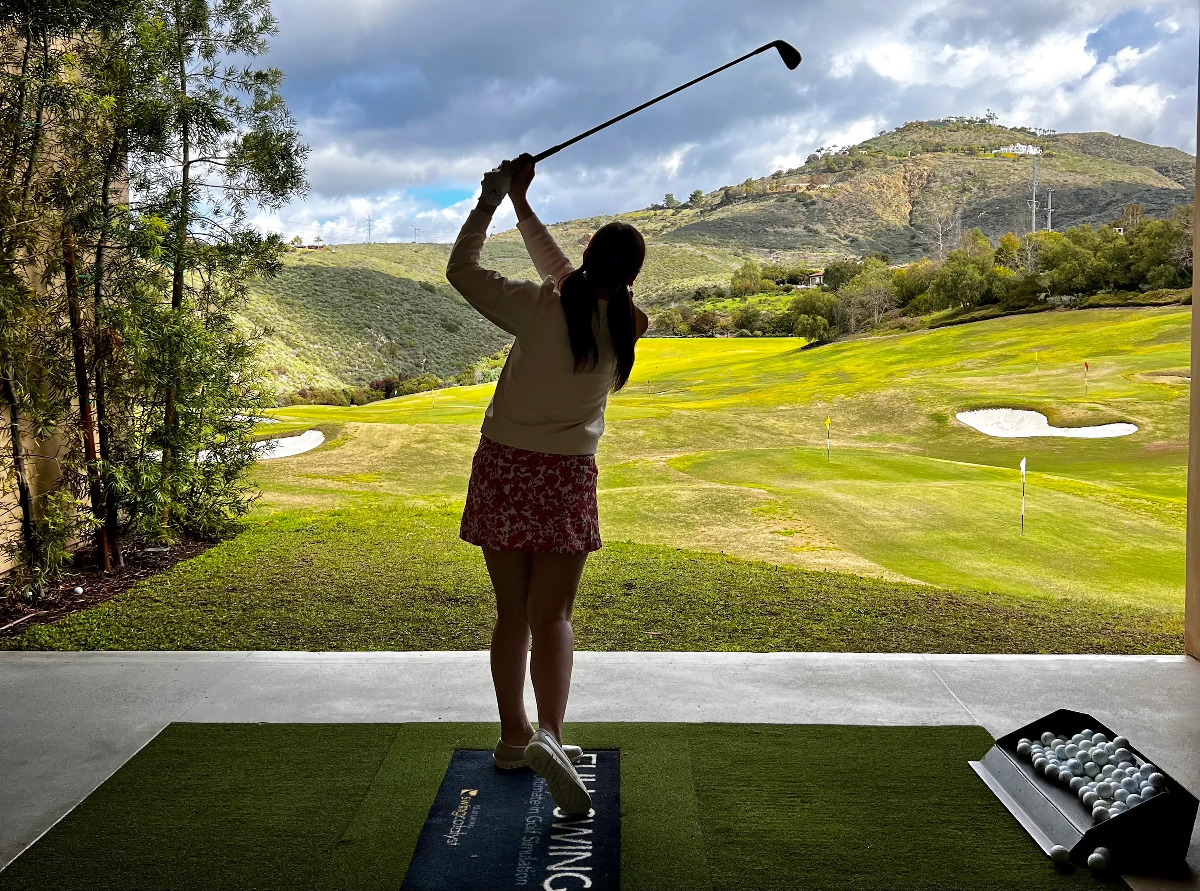 Golfer practicing to stop blocking golf shots