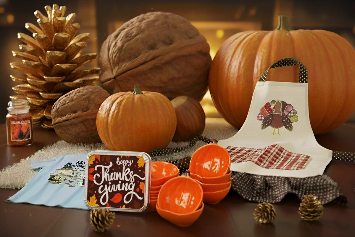 Fireplace scene with large pumpkins and nuts with a selection of amazon thanksgiving products, ramekins, apron, candle, food container